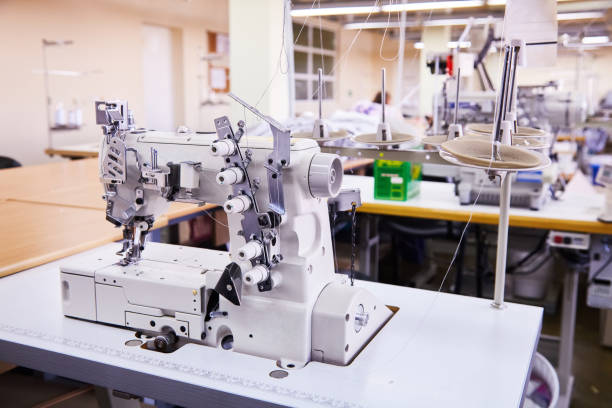 macchina per cucire - sewing textile garment industry foto e immagini stock