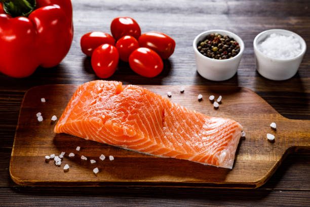 istock Fresh raw salmon steak on stone plate 1135078063