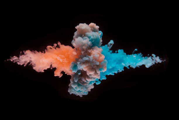 istock Coloured acrylic ink mixing in water on black 1135078201