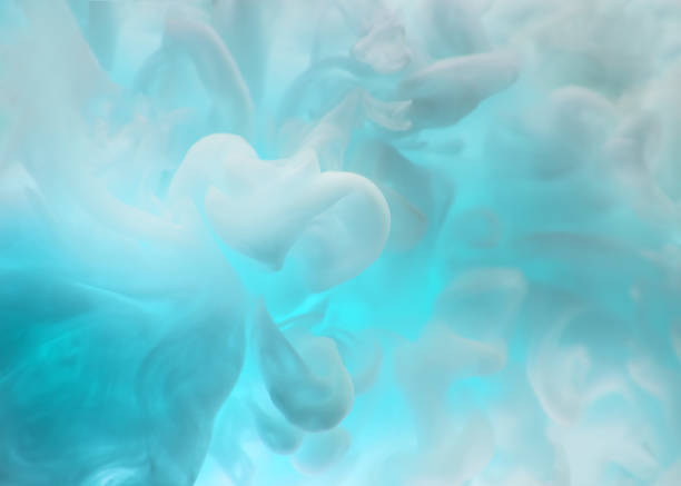 istock Coloured acrylic ink mixing in water on black 1135078253