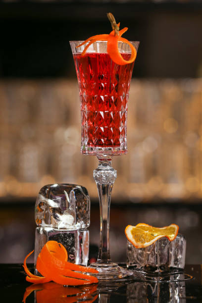 istock Kir Royal cocktail with orange slice and ice cubes 1135078396