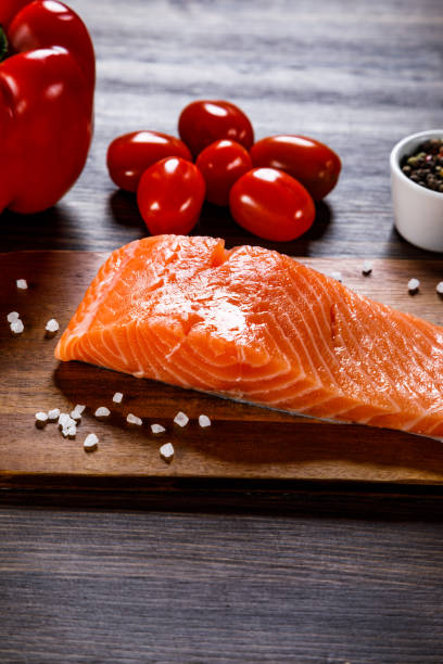 istock Fresh raw salmon steak on stone plate 1135078639