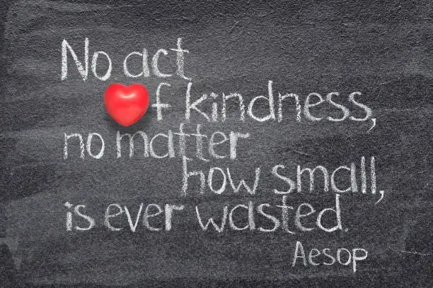 No act of kindness, no matter how small, is ever wasted - quote of ancient  Greek story teller Aesop written on chalkboard with red heart instead of O