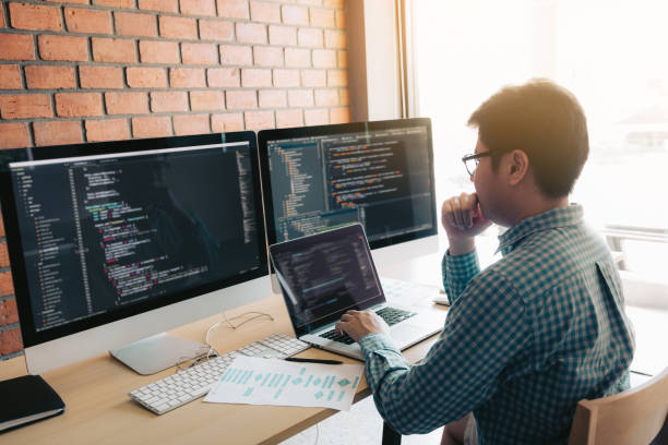 Developing programming and coding technology working in a software develop company office. Developing programming and coding technology working in a software develop company office. java programming language stock pictures, royalty-free photos & images