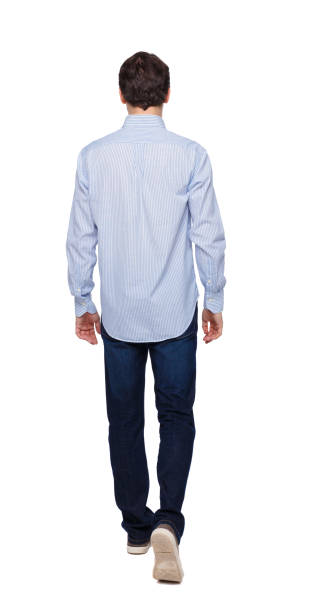 istock Back view of going  handsome man . walking young guy . 1135078788