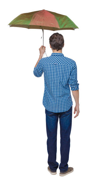 istock Back view of a man with an umbrella. 1135080135