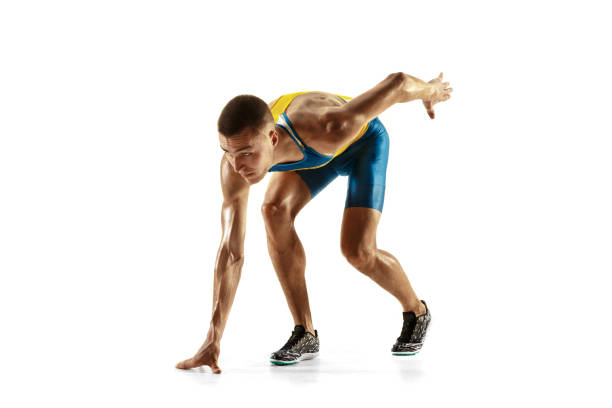 istock Young caucasian man running or jogging isolated on white studio background. 1135080141