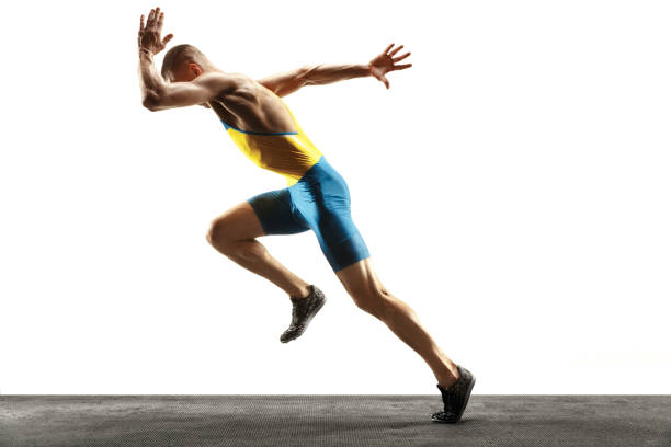 istock Young caucasian man running or jogging isolated on white studio background. 1135080199