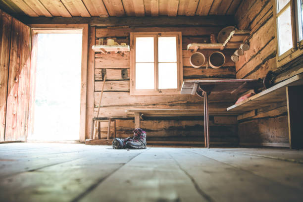 istock Alpine boots on rustic wood floor in an abandoned mountain chalet in Austria 1135080221