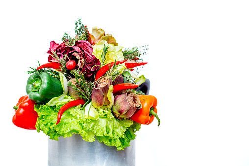 Vegetable bouquet arrangement inside a cooking pot