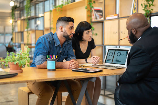 Agent talking to a couple in the office
