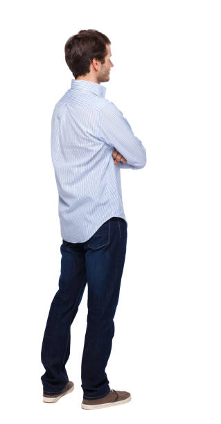istock Back view of man in dark jeans. Standing young guy. 1135081650