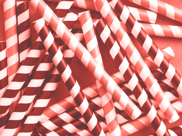 istock Red and black striped straws. Coral toned 1135082410