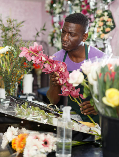 istock Florist preparing orchids for bouquet 1135082979