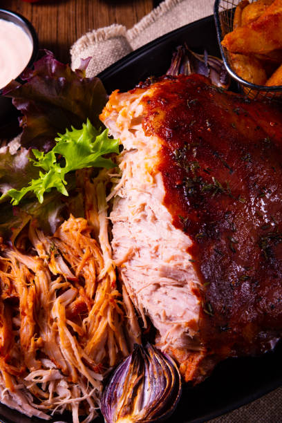 istock delicious pulled pork with baked potato quarters 1135083160