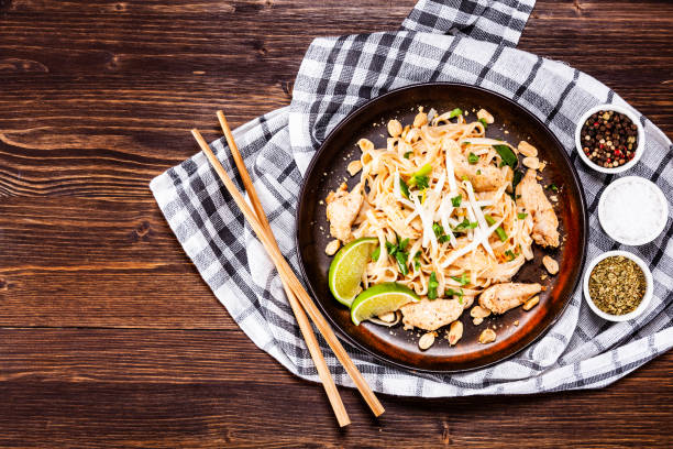 istock Pad thai - chicken meat with noodles and vegetables 1135083667