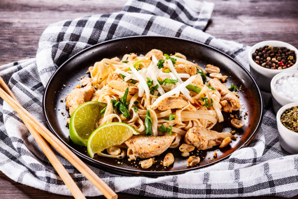 istock Pad thai - chicken meat with noodles and vegetables 1135084356