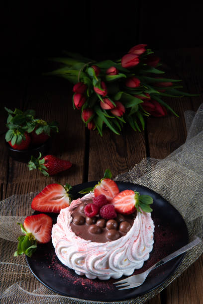 istock light pavlova with fresh fruits and chocolate 1135084470