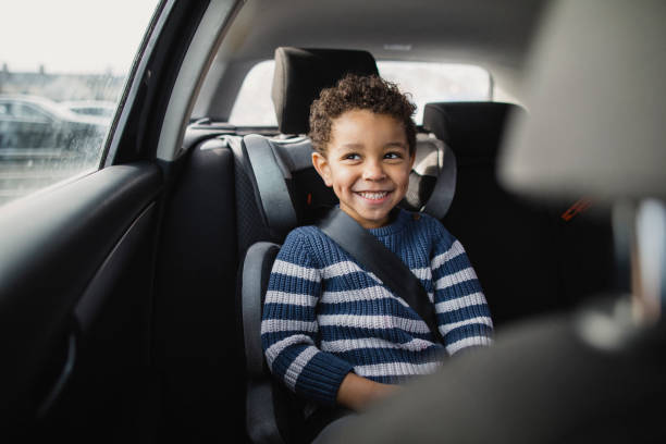 Commuting by car Young boy excited to be going on a car ride. seat belt photos stock pictures, royalty-free photos & images