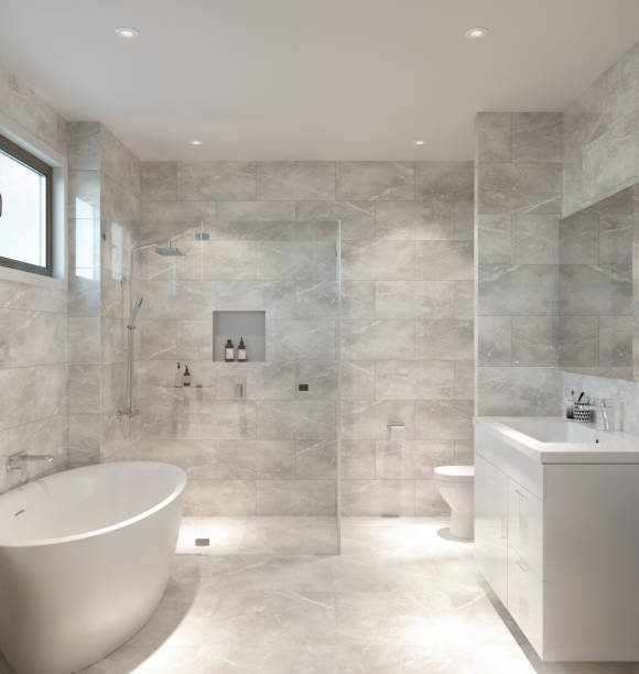 Luxury Ensuite Bathroom Frame-less glass shower, floor to ceiling stone tiles, freestanding bathtub, gloss white vanity. free standing bath stock pictures, royalty-free photos & images