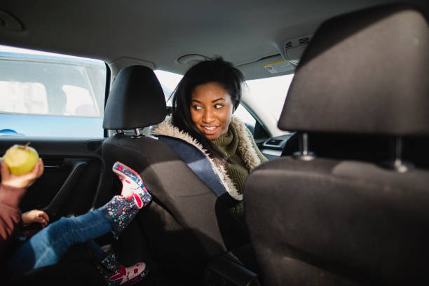 istock Mother and Daughter Travelling by car 1135085474