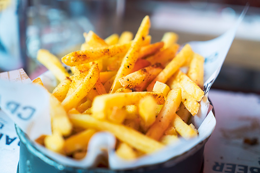 Close-up of French Fries on table in pub