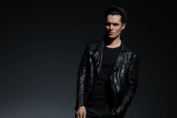 istock young fashion man in leather jacket looking upset 1135086704