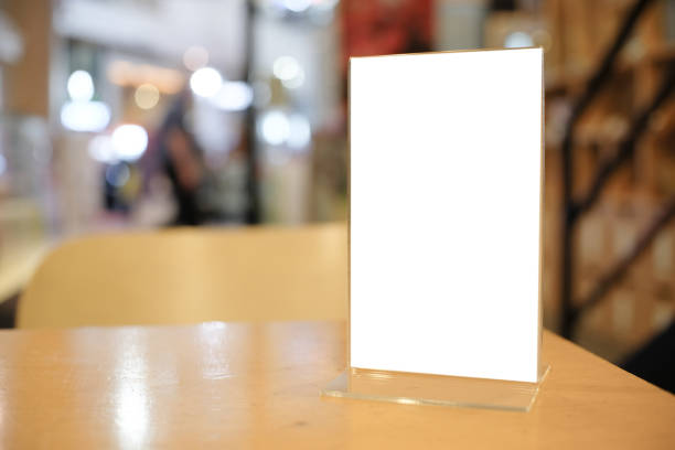 istock Menu frame space for text marketing promotion standing on wood table in Bar restaurant cafe. 1135087937
