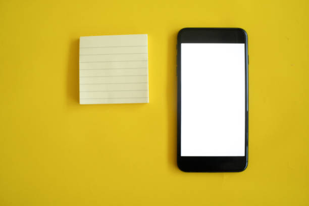 istock Mockup of smart phone on office desk. 1135087984