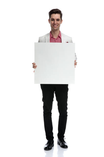 istock smiling young man showing a blank board 1135088132