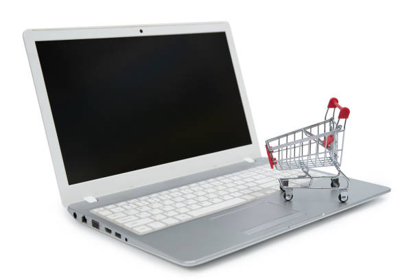 istock Internet online shopping concept with computer and cart 1135088287