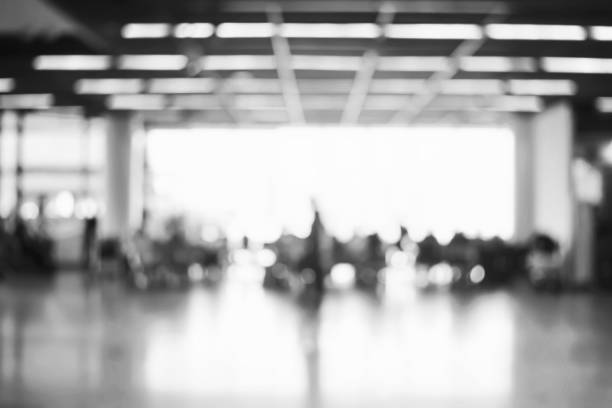 istock Blur background : Passenger waiting for flight at airport terminal blur background with bokeh light 1135088678