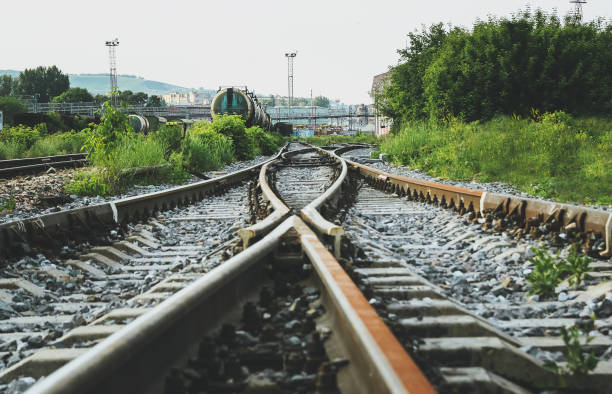 two railways tracks merge close up. - connection merger road togetherness imagens e fotografias de stock