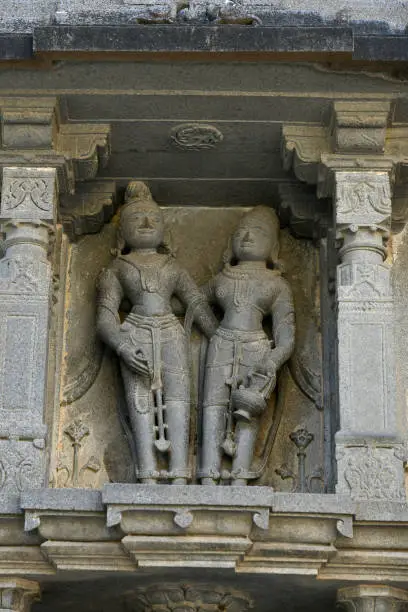 Photo of Statue on stone wall carvings at Vitthal Temple, Palashi, Parner, Ahmednagar