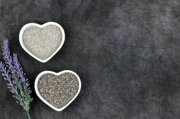 istock Black and white chia seeds with flower decoration 1135090031