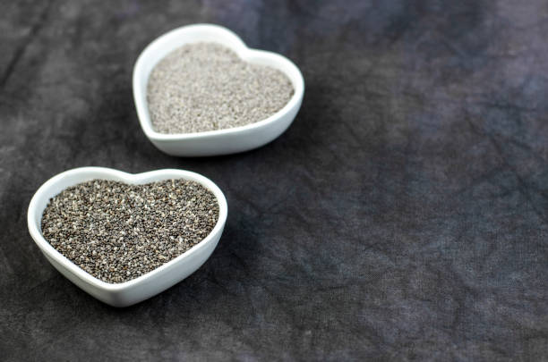 istock Black and white chia seeds on dark background 1135090062