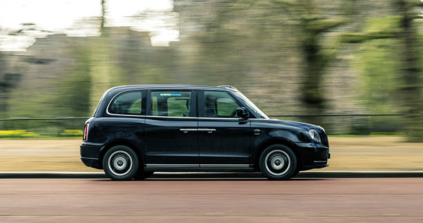 Motion TX Electric Black Cab in London 9 March 2019 - London, England. Motion Picture of new modern model TX The Electric taxi "Black Cab". black taxi stock pictures, royalty-free photos & images