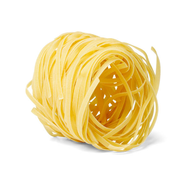 istock Noodles tagliatelle. One nest. White isolated background. 1135093241