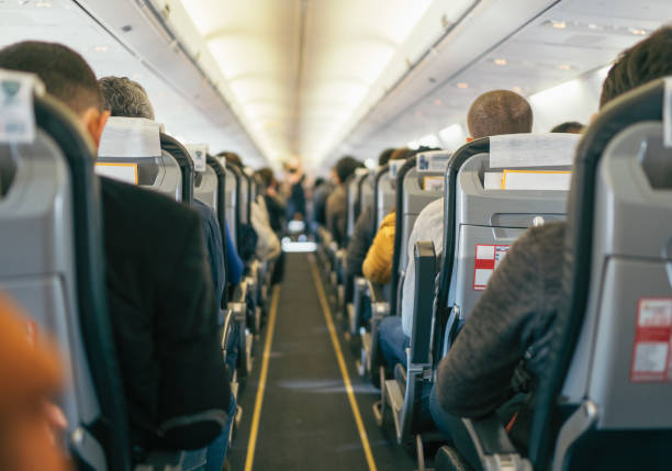 istock Commercial aircraft cabin with passengers 1135093323