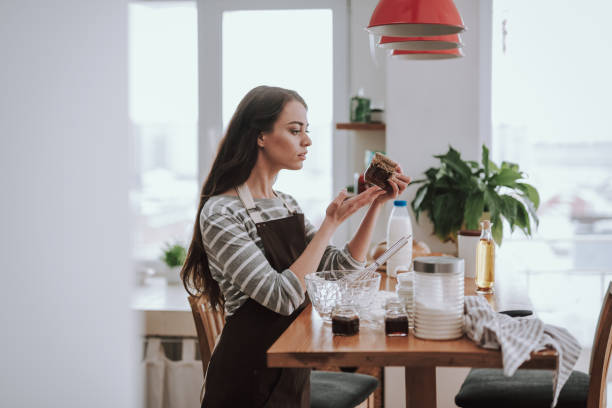 istock Woman is choosing ingredient for cooking at home 1135095941