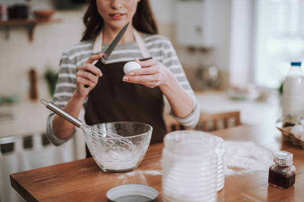 istock Young pretty lady is making homemade bakery 1135095957