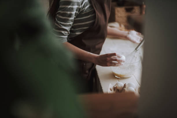 istock Female is kneading dough on kitchen at home 1135096006