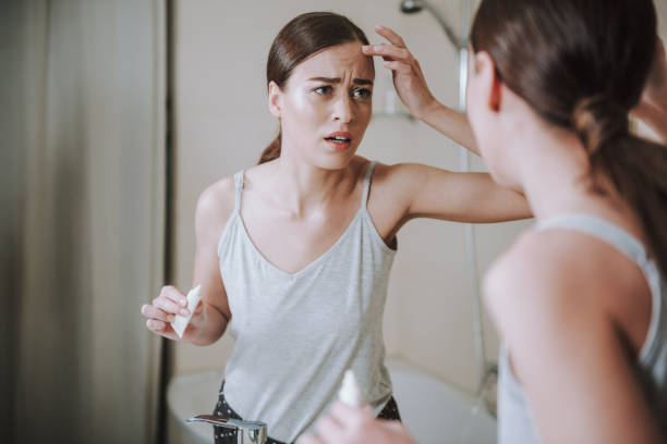 istock Stressed young woman having some skin problems 1135098537