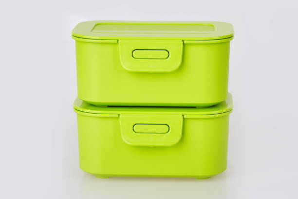 istock Pair of similar  green plastic food storage container 1135098912