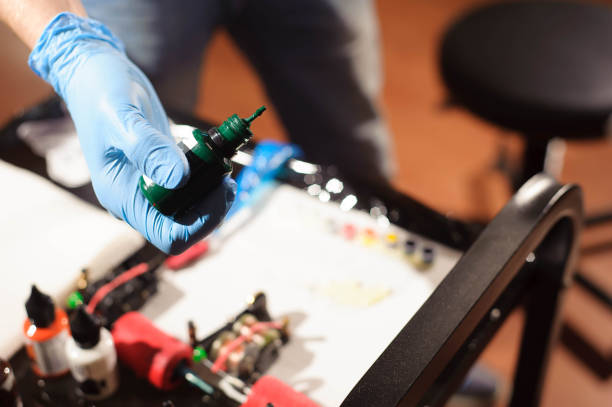 istock Tattoo artist at work. Close up 1135099275