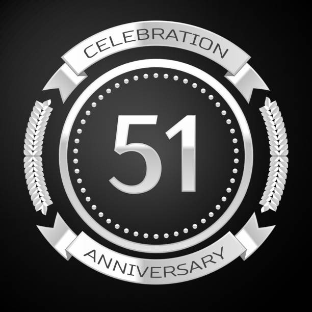 istock One Years Anniversary Celebration Design. Silver ring and ribbon on black background. Colorful Vector template elements for your birthday party 1135100531