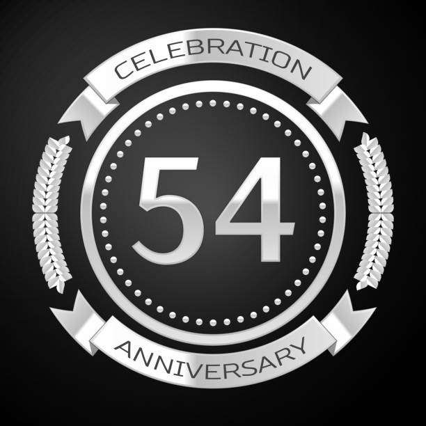 istock One Years Anniversary Celebration Design. Silver ring and ribbon on black background. Colorful Vector template elements for your birthday party 1135100540
