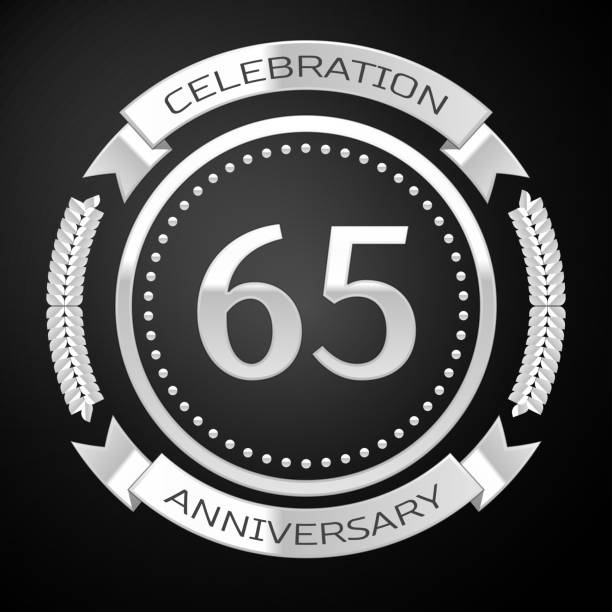 istock One Years Anniversary Celebration Design. Silver ring and ribbon on black background. Colorful Vector template elements for your birthday party 1135100586