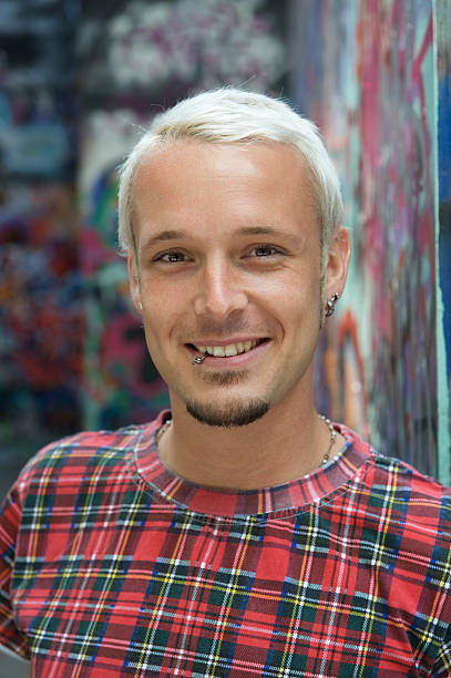 istock Portrait of Cool young man against graffiti background 113510078