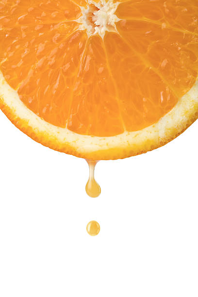 istock drop of juice falling from orange half isolated 113510151